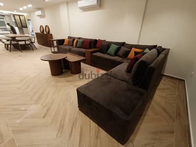 9-11 Person L-Shaped living room with separator and 2 tables