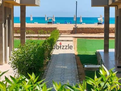 Receive immediately a ground floor chalet with a garden directly by the sea in Sidi Hanish