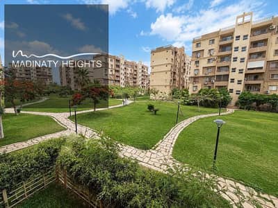 For sale apartment in Madinaty Phase B6 with an area of 143 meters, a very special location and an open view overlooking a wide garden providing privacy and a wonderful view. The apartment consists of 3 bedrooms and 2 bathrooms, and special modifications have been completed with ultra-super-lux finishes and high-quality materials, making it ready for immediate occupancy.