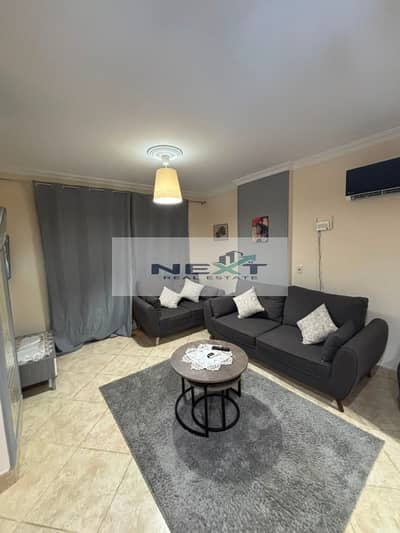 For sale in Madinaty: a 64 sq m studio apartment with 1 bedroom and 1 bathroom, located on the ground floor without a garden. It boasts a prime, vibra