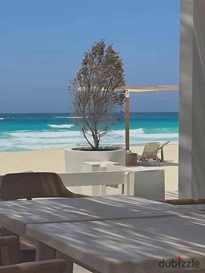 Direct sea-view chalet, ready for immediate handover and fully finished, located in the North Coast at the Direction White project, Ras El Hekma.
