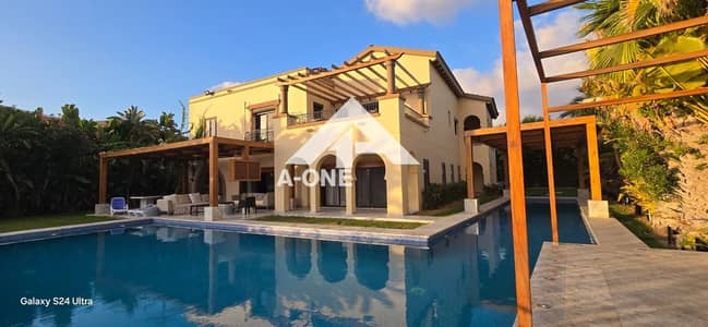 A highly luxurious villa for rent in Marassi featuring a private swimming pool and a direct view of the lake North Coast Sidi Abdel Rahman