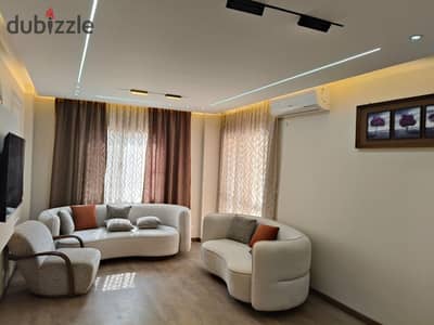 Furnished hotel apartment for rent in Madinaty, view wide garden, special finishes, area 110 meters
