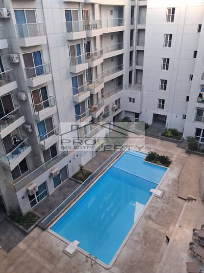 Apartment for sale in Al Naseem Heights compound, 107 square meters, excellent location in the city center, directly on Al Hadaba Road next to Raya