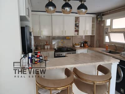 Fully Furnished Ground Floor Apartment with Double View Garden for Sale – El Khamayel Compound, Sheikh Zayed