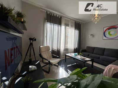 Studio apartment in Village Gate, Palm Hills Resale, fully furnished with kitchen and air conditioning - prime location with an open view