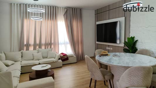 Apartment for rent in Kayan Compound, 6th of October City; features ultra-modern finishing, and includes the kitchen and air conditioning units