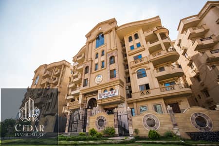 Apartment for sale in a very distinctive location, panoramic front view on the facade, steps from Al-Wahat Road, 120 meters, Small Investor, south of the neighborhoods, 6 October City