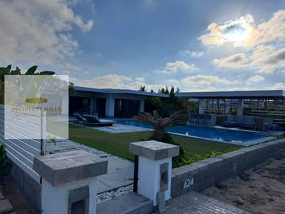 Standalone villa, first row on the lagoon, for sale in Almaza Bay, North Coast.
