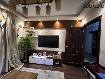 Garden lovers in a garden inside the fifth with 3 bedrooms, 2 bathrooms, and an external room in the garden. The apartment is sea-facing, close to Mohandessin and New Giza.