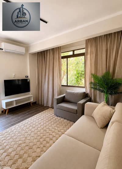 Furnished hotel-style studio apartment for rent in Sarayat El Maadi, Gardens Street, surrounded by trees and villas, next to restaurants and international brands.