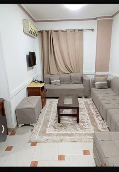 Apartment for rent in the first neighborhood in front of October University, first floor from the owner, direct, clean furnishings