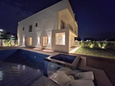 A fully finished standalone villa for resale in Grand Heights compound, near Mountain View, October Plaza, Beverly Hills and Zayed 2000.