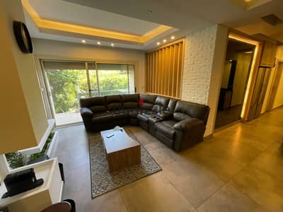 For sale, a ground floor with a garden in The Address Sheikh Zayed, ultra-luxury finishing with furniture and appliances.