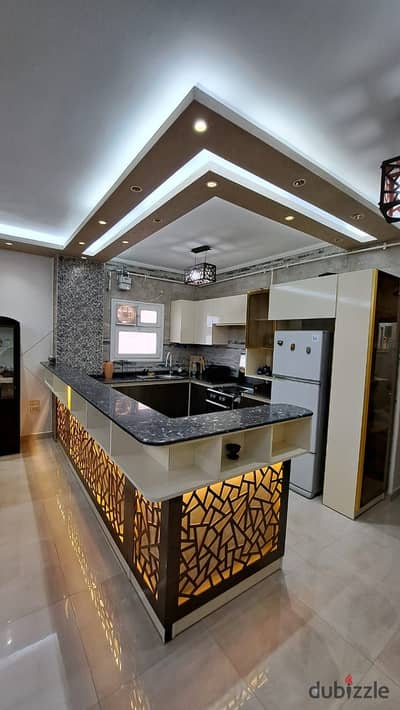 Furnished apartment for rent in Sheikh Zayed (District 8, Neighborhood 4). Prime location: close to Espana Mall, minutes from The Gate Mall, and adjacent to all amenities and transportation links. Located on the first floor of a luxury residential villa.