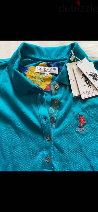 تيشرت بولو حريمي U. S. Polo Assn. أصلي (جديد تماماً بالتايك) - مقاس XS