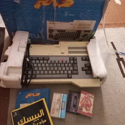 كمبيوتر صخر للألعاب  مع شرايط و كتب شرح