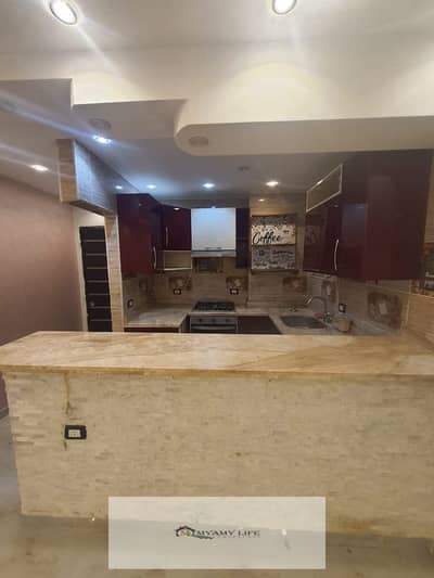 For rent in Al-Ahram Gardens, a 115 sqm super lux apartment with electricity, water, and kitchen included, located in a prime area near Calle and the building is on the main second gate street.