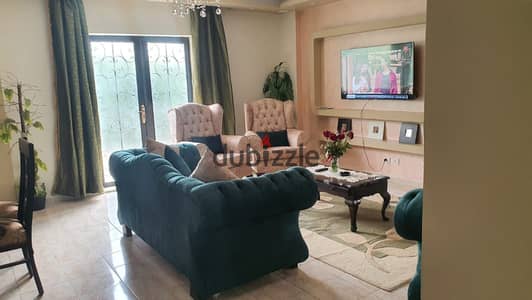Furnished 110m² apartment for rent in Al Rehab 2 | Ground floor with a 50m² garden, modern furnishings, villa and garden view, next to Avenue Mall and Carrefour