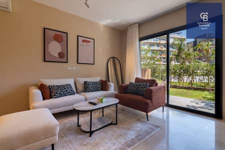 Furnished apartment with a garden for rent, featuring luxury hotel-style finishing and appliances, located in the most prestigious compound in New Cai