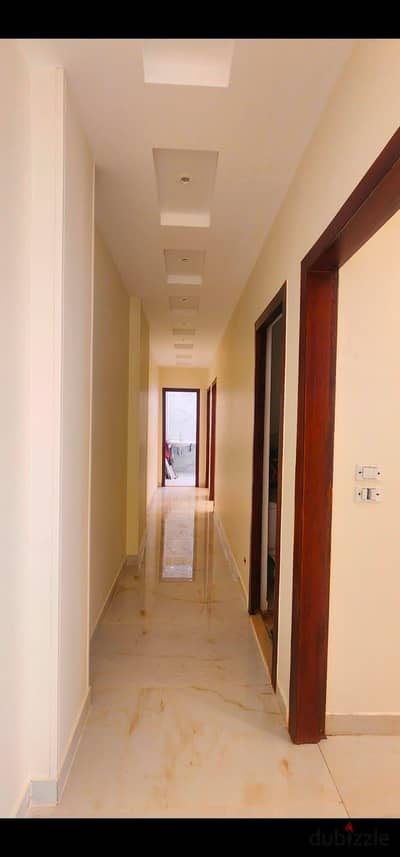 In the most upscale compound, an apartment with three rooms, a living room, three bathrooms, and a kitchen.