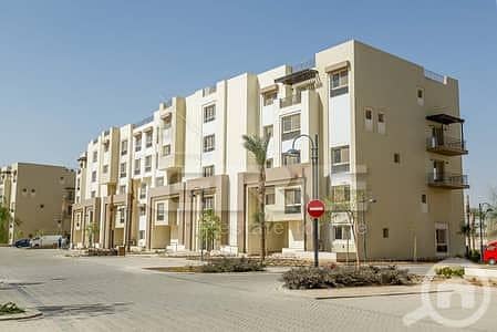Apartment for sale in Uptown Cairo, fully finished with air conditioning, 3 bedrooms + mezzanine, at the lowest price.