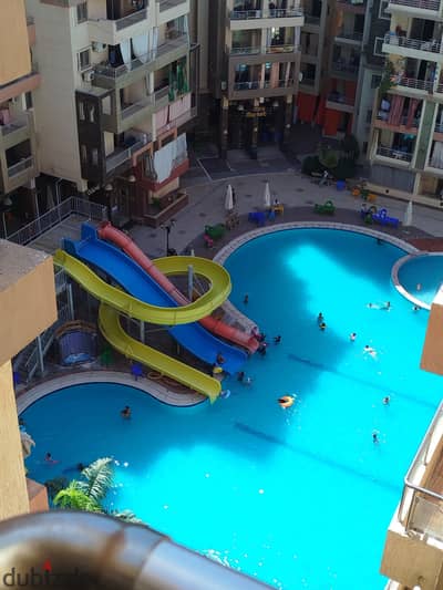 Apartment for sale in Alexandria, Al-Nakhil Beach, Al-Agami, within a complete services compound, swimming pools, green spaces, suitable for living and good investment