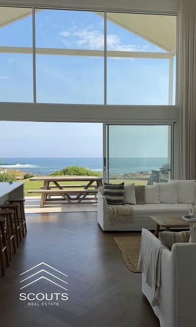 Chalet for sale, immediate delivery, sea and lagoon view, finished with air conditioning and kitchen, in Hacienda Palm Hills North Coast