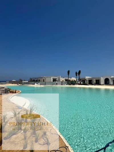 Receive a 44% discount for cash on a villa for sale with lagoon view, fully finished ultra-super lux - The Mid - Ras Al Hikma - North Coast