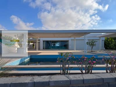 Standalone villa, first row on the lagoon, for sale in Almaza Bay, North Coast.