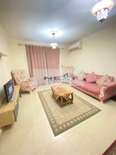 Furnished apartment for rent in Madinaty, 92 sq m in B6, high-end finishing, clean furnishings, fully air-conditioned, direct sea view, wide garden vi