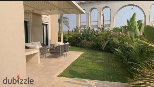 Finished ground floor apartment with garden for sale, ready to move, in Village West Sheikh Zayed Compound