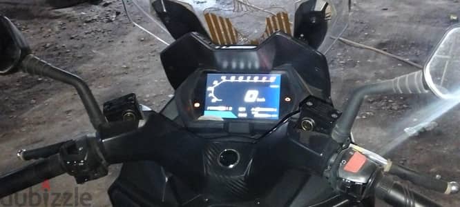 اسكوتر أس واي ام جييوماكس بصمه