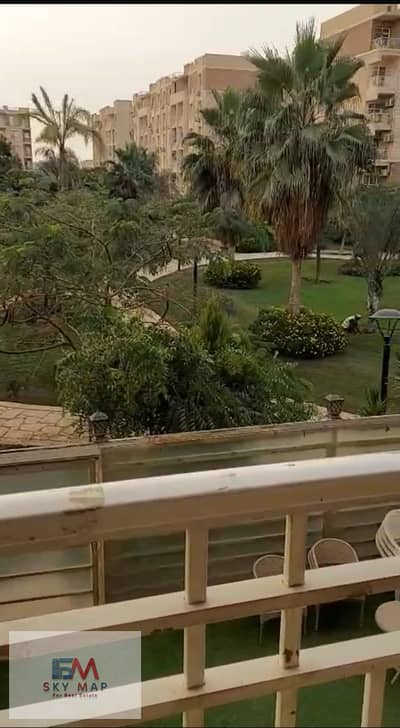 For rent in Madinaty (B11): A 96-square-meter apartment featuring a "Smart" layout and a prime, north-facing location overlooking a wide garden. The u