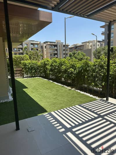 Luxury furnished ground floor apartment with a private garden for rent in Azad Compound, ideally located next to Sodic Eastown and the American Univer