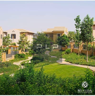 Townhouse for sale below market price, resale, ready to move fully finished in Mivida _Emaar Fifth Settlement compound with an open view on landscape