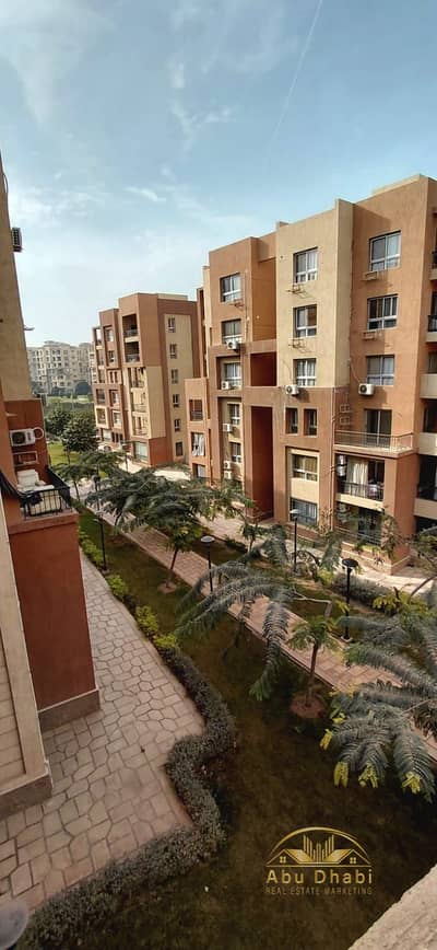107-square-meter apartment for sale in Madinaty (B8), featuring an open view of the garden and amenities.