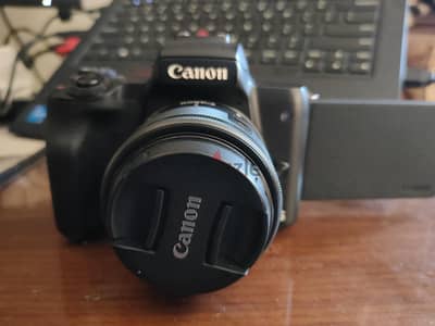 Canon m50 with adapter and 50mm lens and 15-45 lens