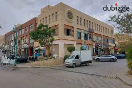 Commercial shop for sale in Al Moez Mall, Sheikh Zayed  Investment opportunity. The shop is shops and the rental value is 12,000  Possibility of the tenant leaving at any time  Area of 38 meters  On two floors, a special location at a snapshot price
