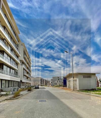 For rent, an empty apartment on the ground floor with a garden in Hadaek October [Lake Front Compound] with an area of 140 square meters