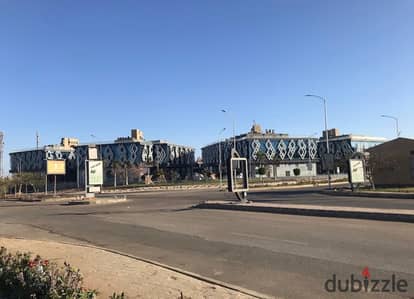 Commercial shop for rent: 80sqm indoor and 120sqm outdoor- Lowest price per square meter in the area- Located directly across from Mall of Arab