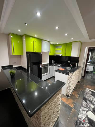 Furnished studio for rent in Al-Rehab, super lux finishes, ground floor with garden