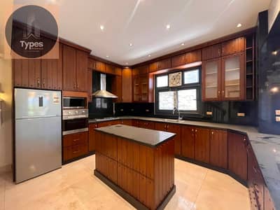 Townhouse for rent with air conditioning, appliances, and kitchen in Patio Zahraa Compound, next to Al Rabwa, Karma 4, and Royal Meadows