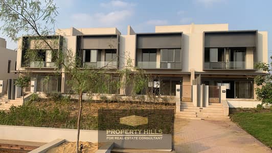 Villa for sale immediate delivery 3 floors with garden view Lago in Sheikh Zayed in front of Emaar next to La Vista