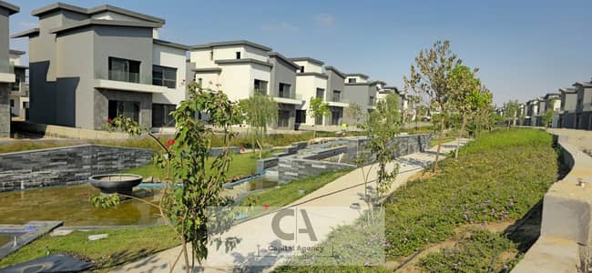 Apartment for sale in the Fifth Settlement in Creek Town Compound, directly in front of Rehab City, with Al-Qassar, ground floor with a garden, for ca