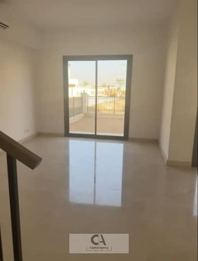 Townhouse villa for sale in Belle Vie, Sheikh Zayed, with Emaar, super lux finishing, and an open view of the landscape. The project is located minute