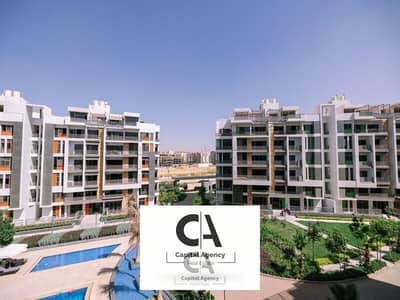 Ground floor apartment for sale with a garden, 5% down payment, in the heart of New Cairo's Fifth Settlement, in the Golden Square, Icon Compound, wit