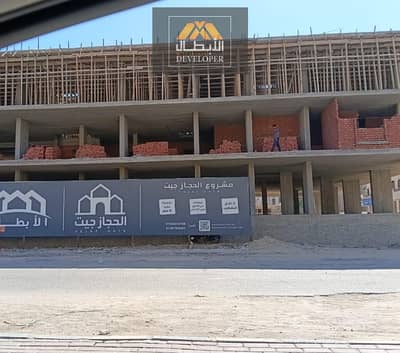 77 sqm, 2-bedroom apartment with a front view on Al Hijaz Main Street, fully finished Super Lux, green contract, and integrated services.