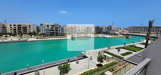 Two-bedroom apartment for sale in Marassi, North Coast, with a view of the swimming pool and marina—priced below market value.