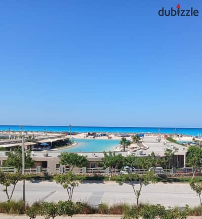 شاليه بروف بأطلاله مباشرة علي البحر في Hacienda West الساحل الشمالي